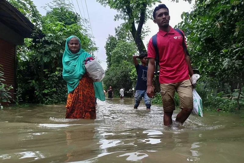 Water began to inundate local areas following the dam collapse. The photo was taken from Burichong upazila this morning